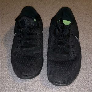 All black Nike shoe